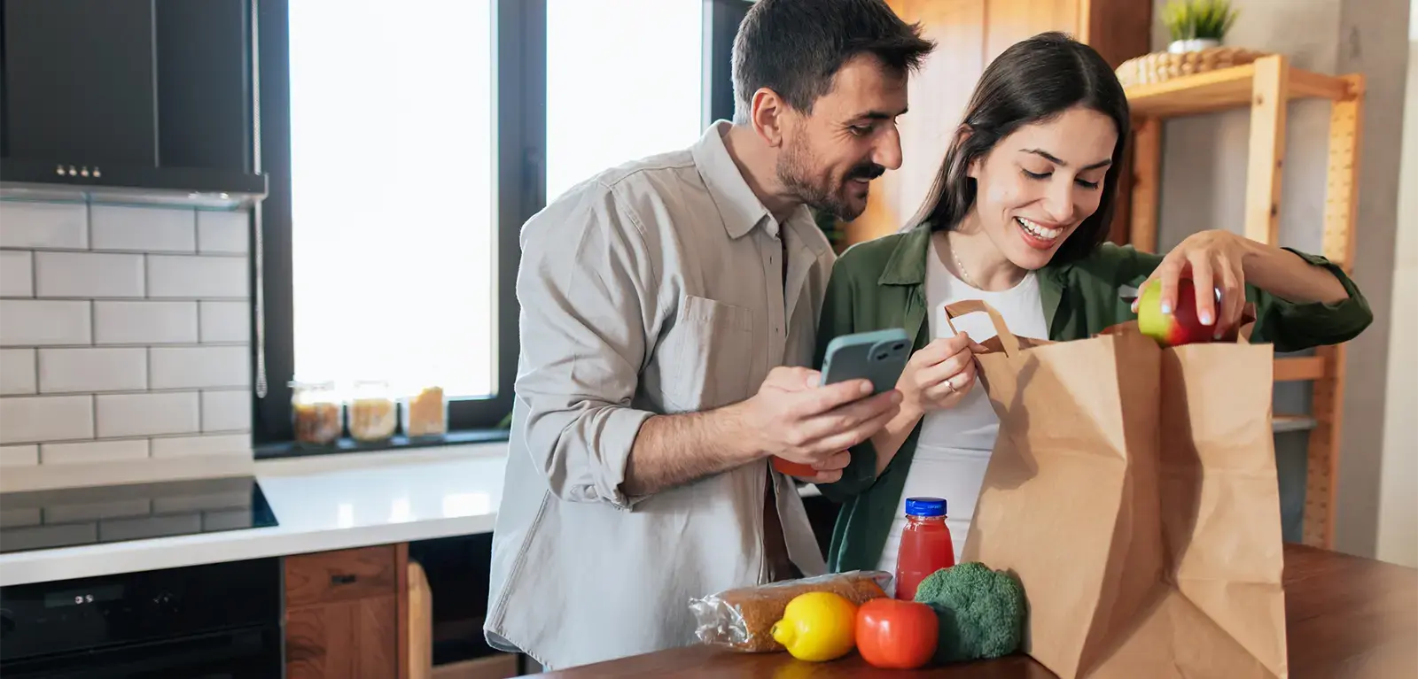 couple unpacking groceries