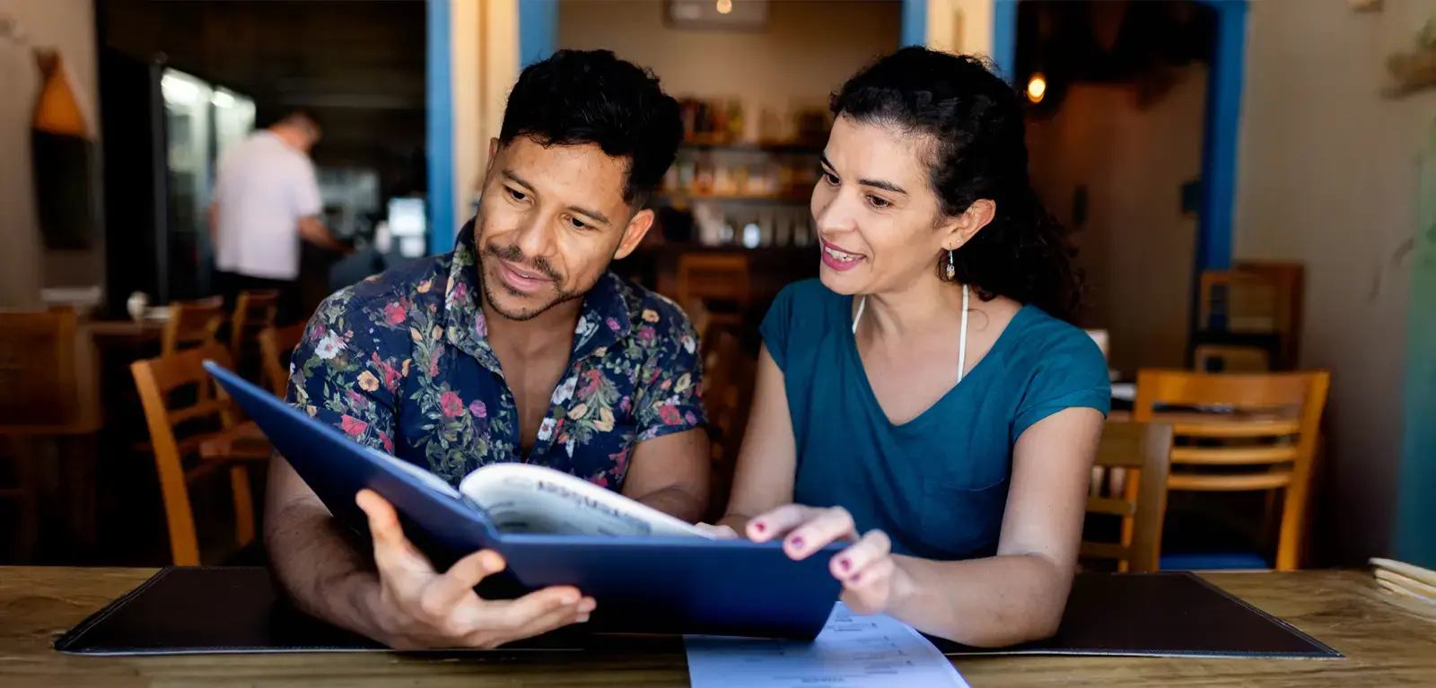 couple reviewing a book