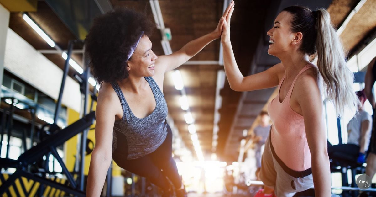 member retention - gym members working out happy